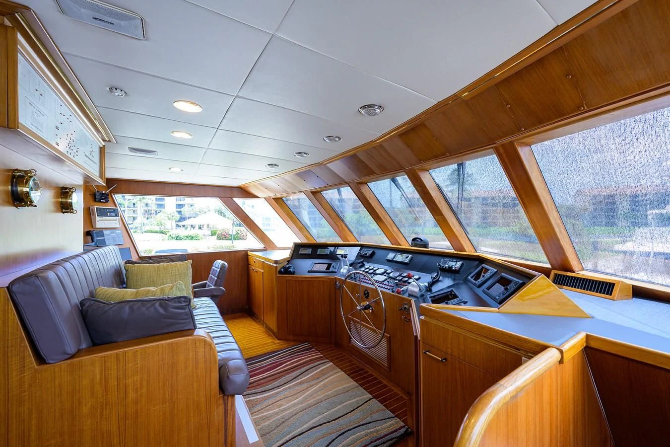 a large open space with a kitchen and living room aboard ARIES Yacht for Sale