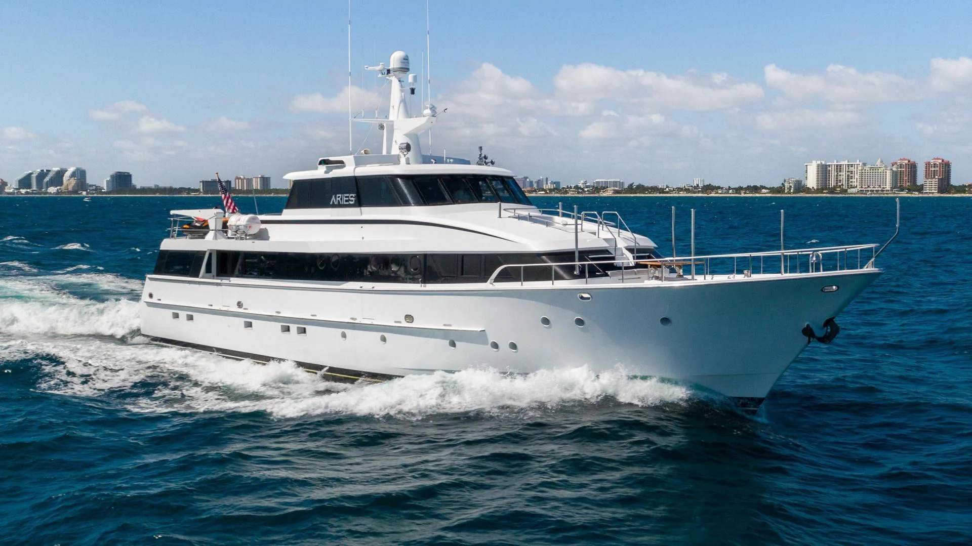 a white yacht on the water aboard ARIES Yacht for Sale