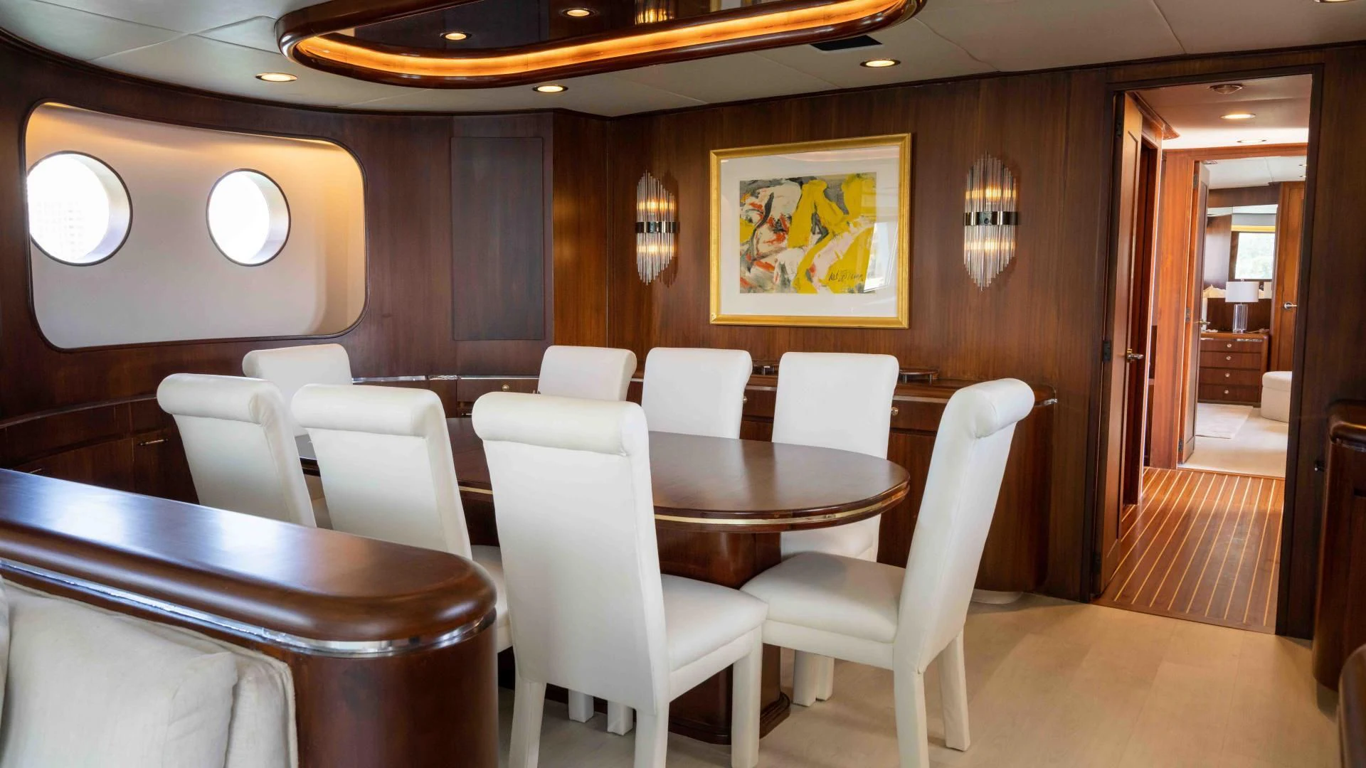 a room with chairs and tables aboard ARIES Yacht for Sale
