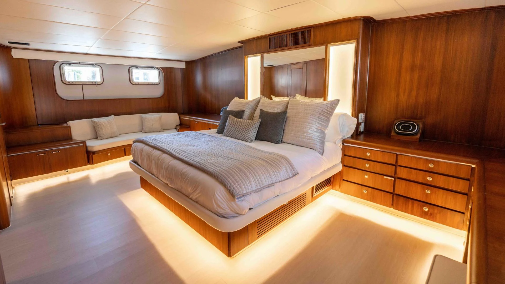 a room with a bed and a couch aboard ARIES Yacht for Sale