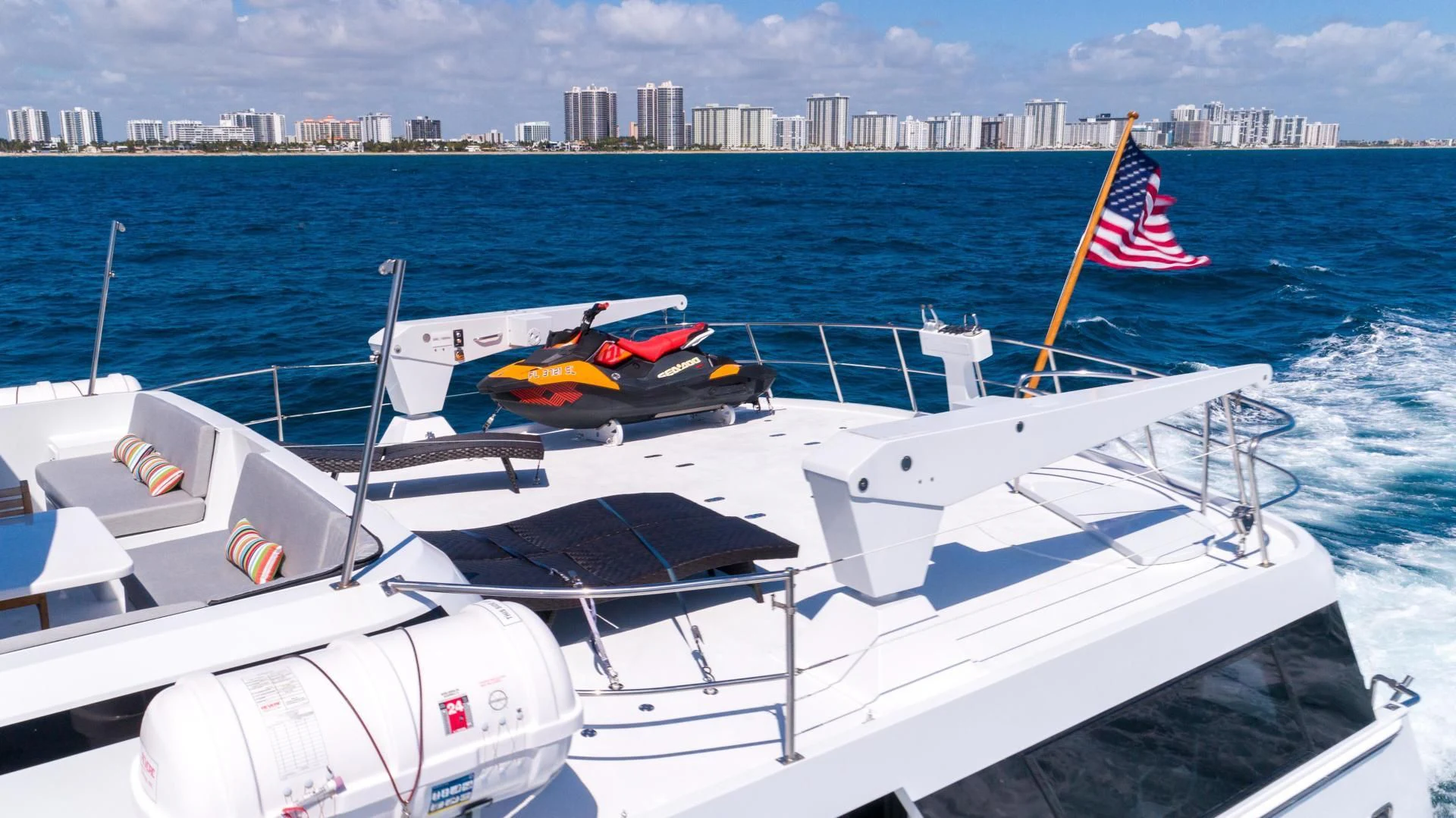 a boat with a flag on it aboard ARIES Yacht for Sale