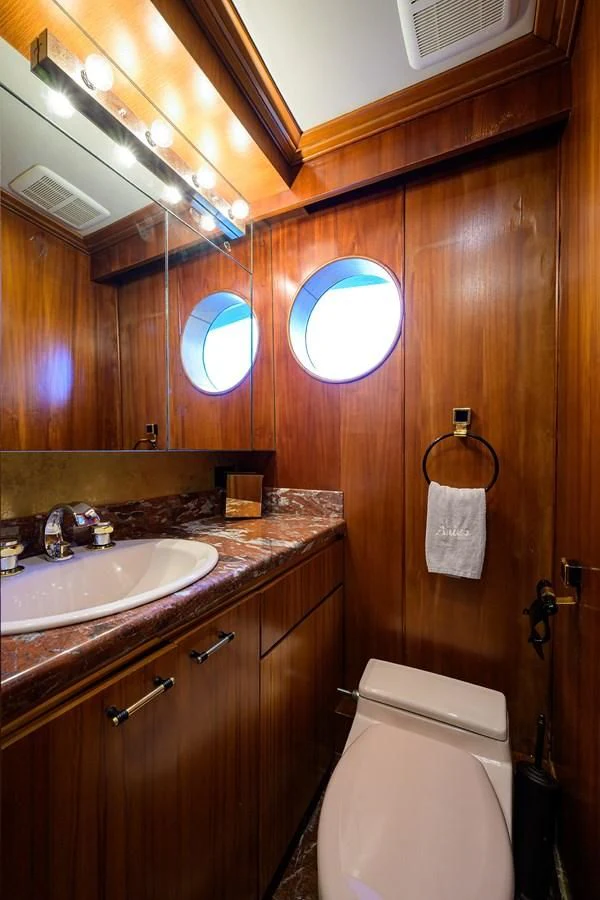 a bathroom with a toilet and a sink aboard ARIES Yacht for Sale