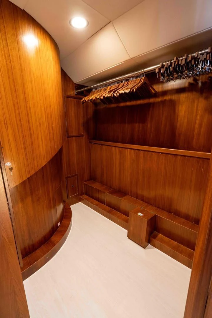 a room with wooden cabinets aboard ARIES Yacht for Sale
