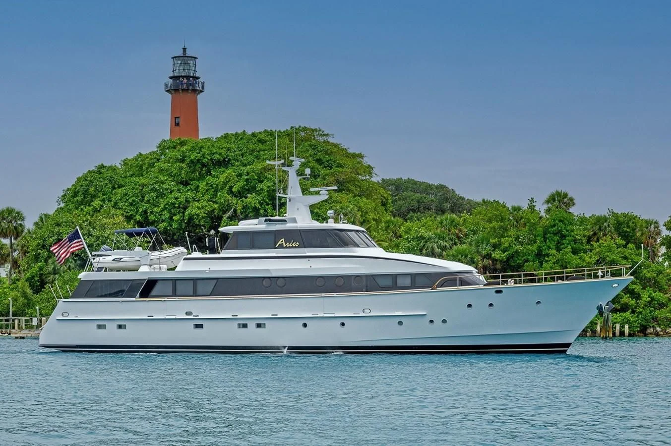 a large white boat in the water aboard ARIES Yacht for Sale