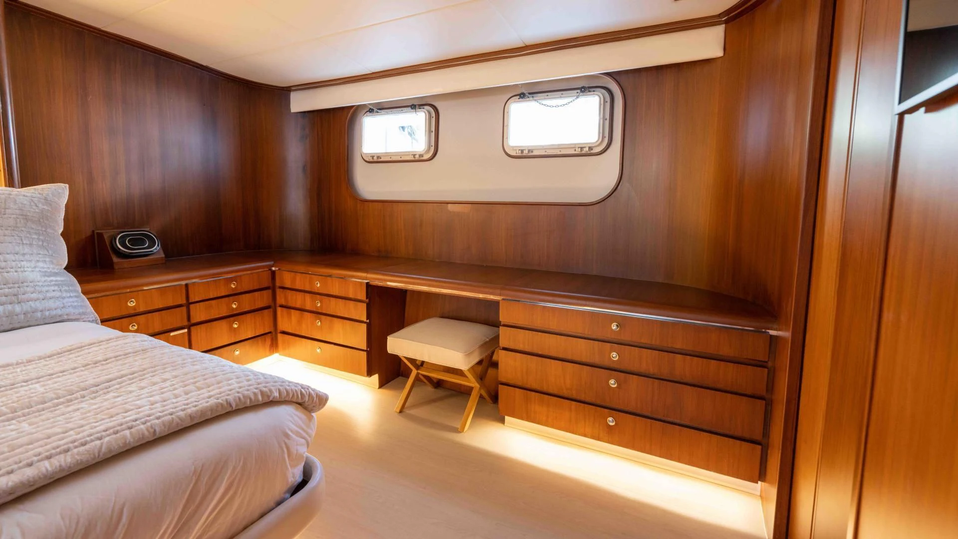 a room with a bed and a desk aboard ARIES Yacht for Sale