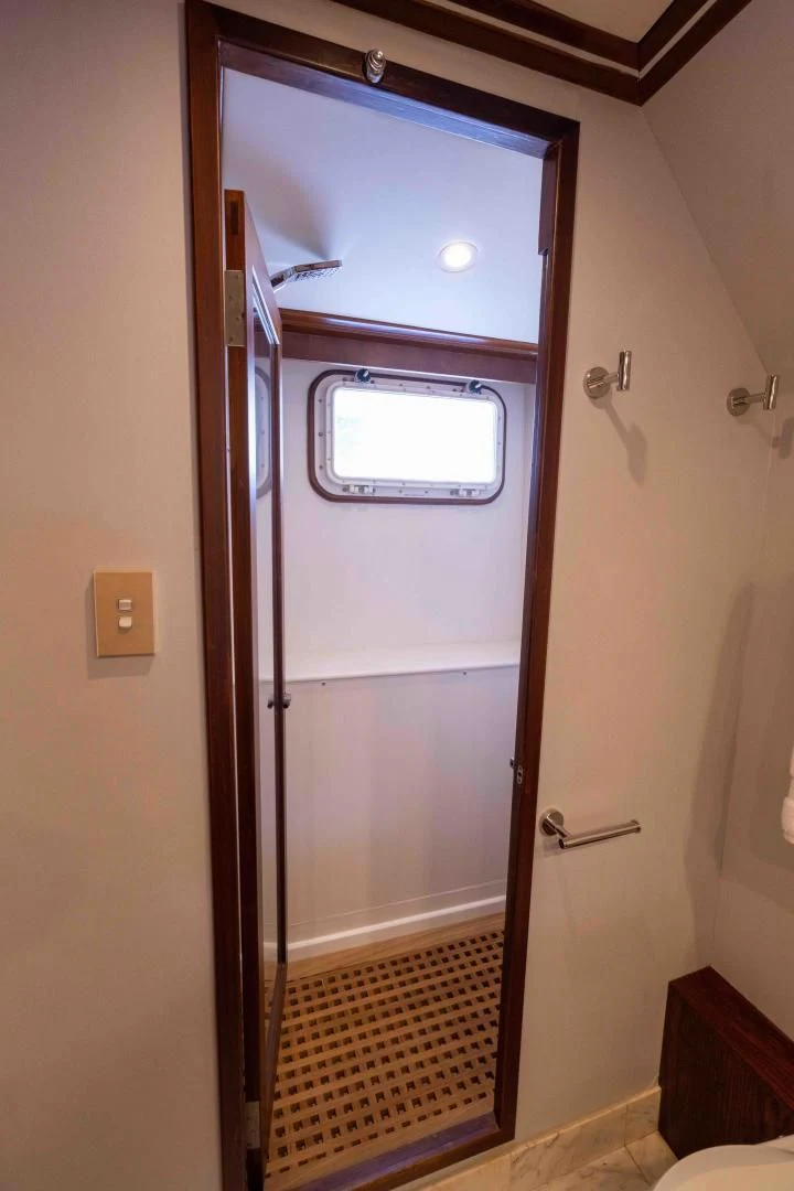 a door with a glass window aboard ARIES Yacht for Sale