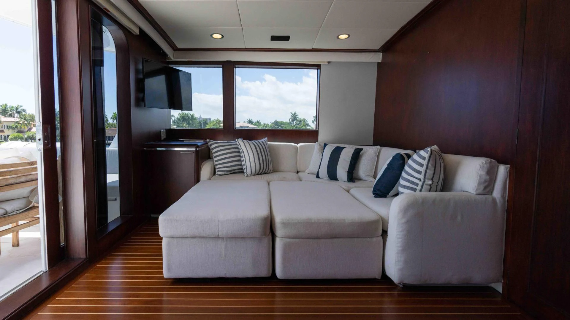 a living room with a couch and a table aboard ARIES Yacht for Sale