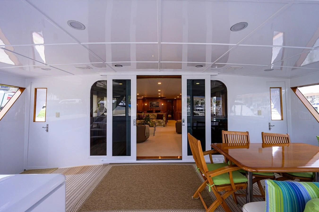 a room with tables and chairs aboard ARIES Yacht for Sale