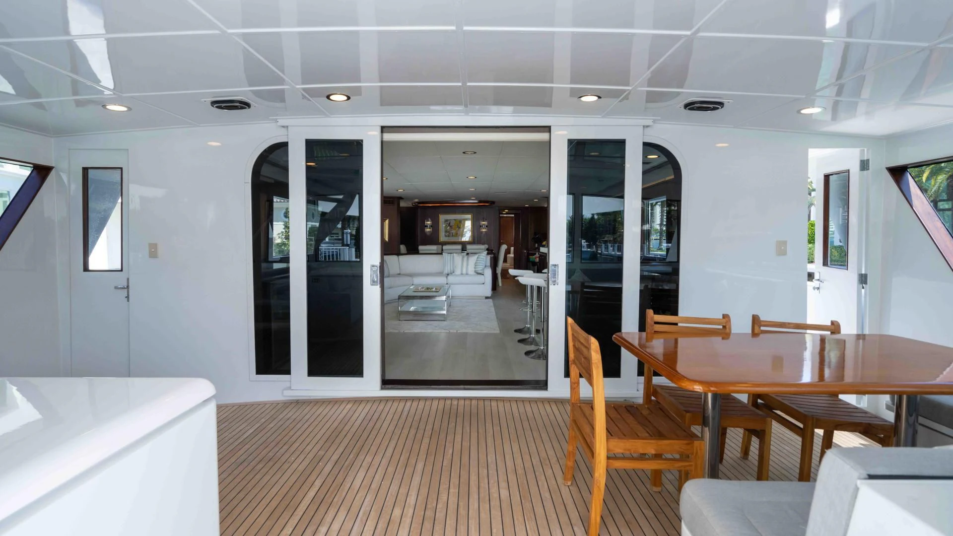 a room with tables and chairs aboard ARIES Yacht for Sale