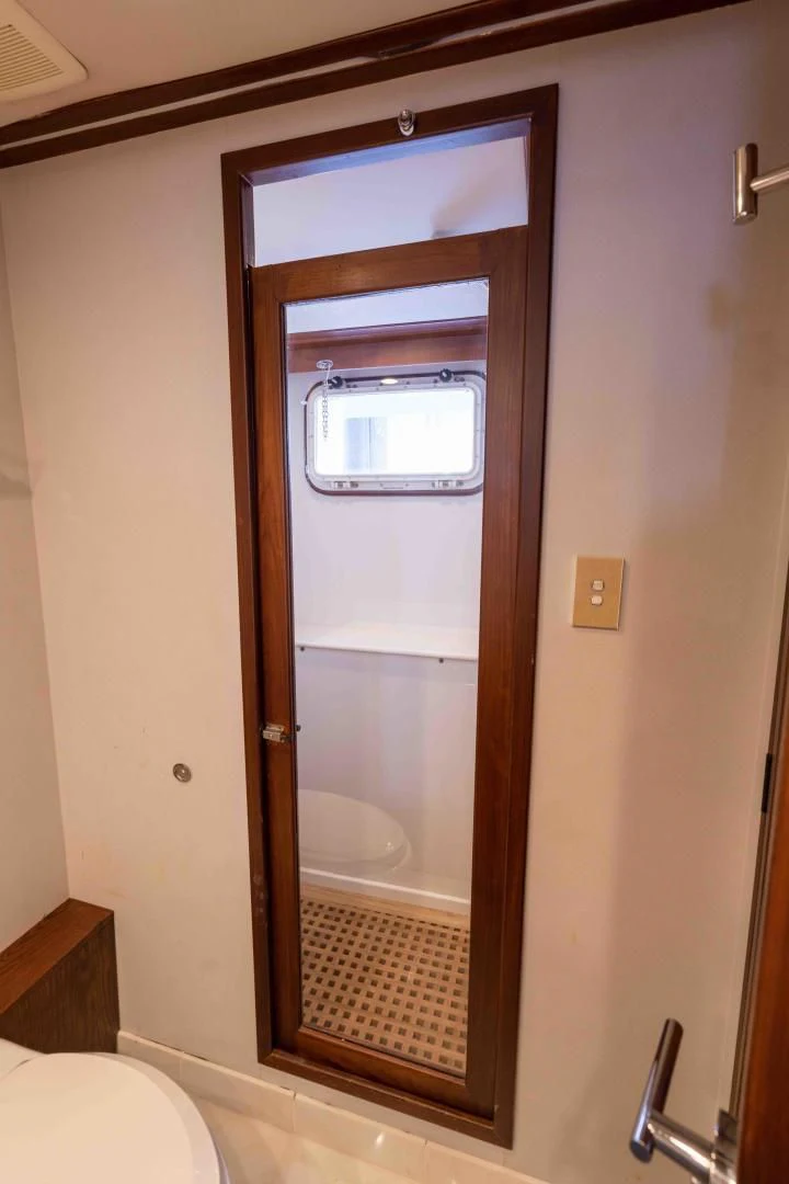 a bathroom with a glass door aboard ARIES Yacht for Sale