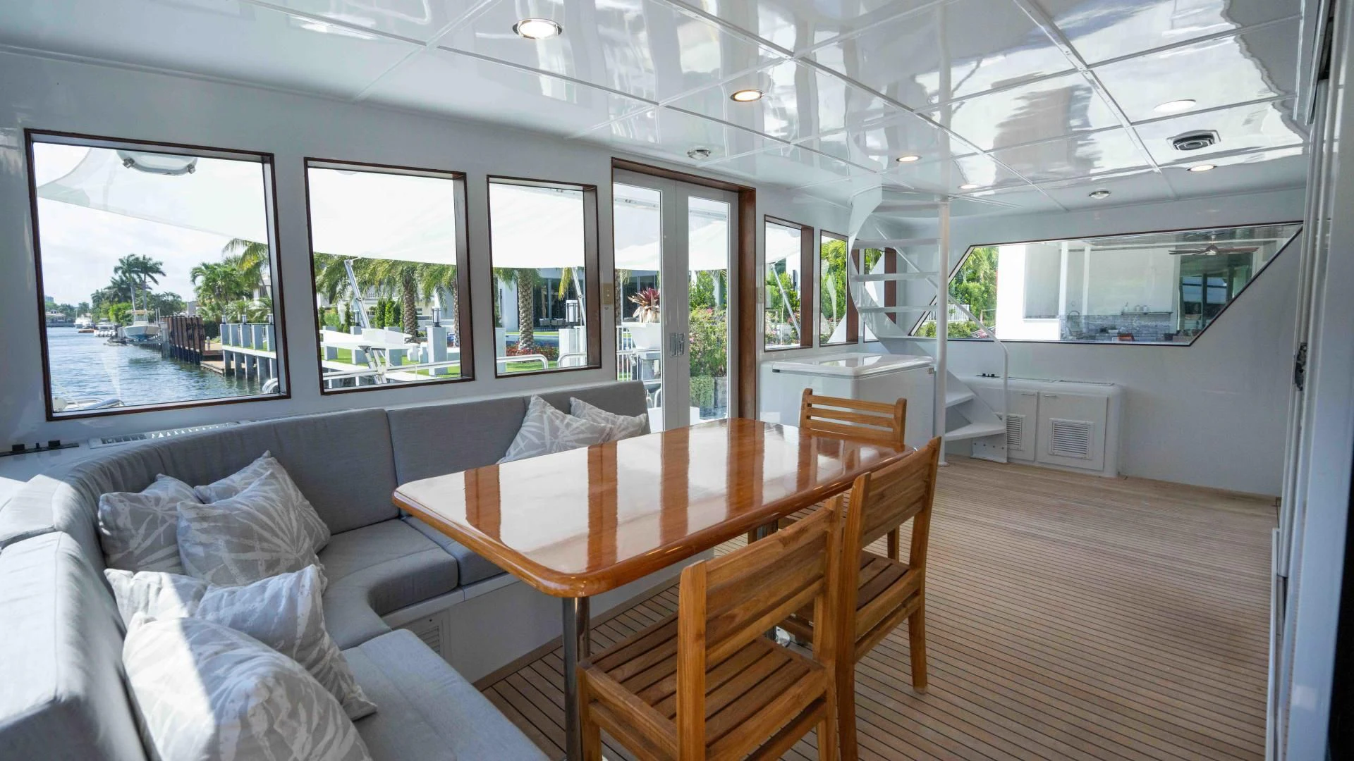 a room with a table and chairs aboard ARIES Yacht for Sale