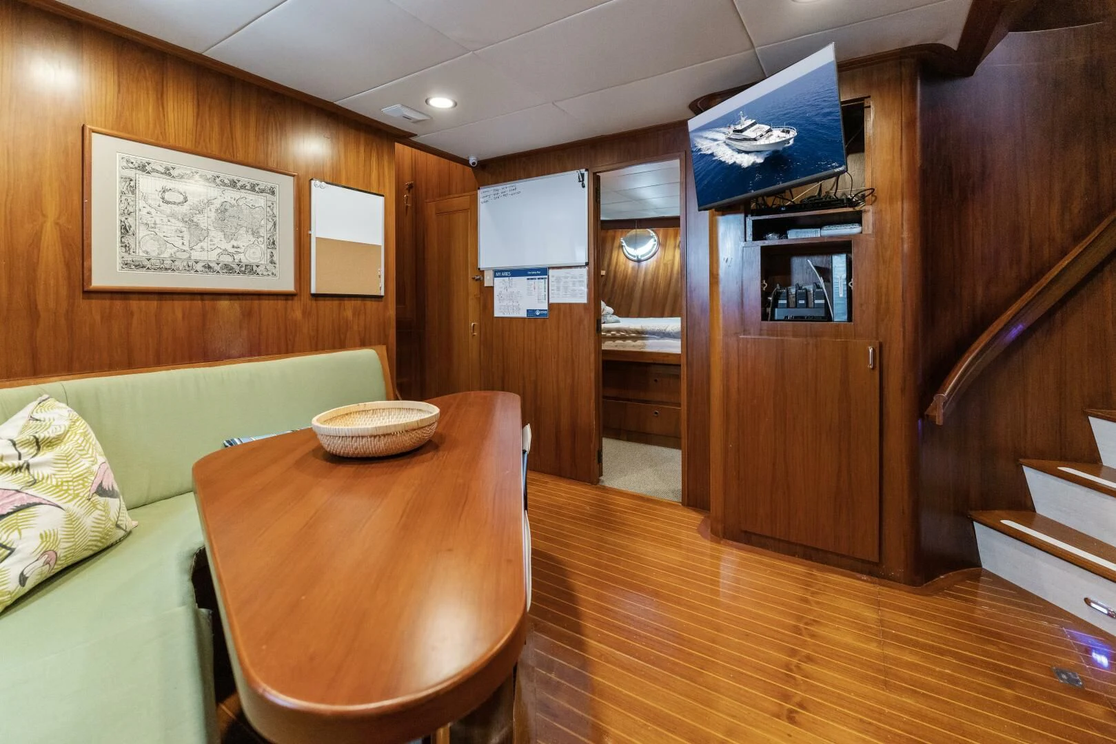 a room with a table and chairs aboard ARIES Yacht for Sale