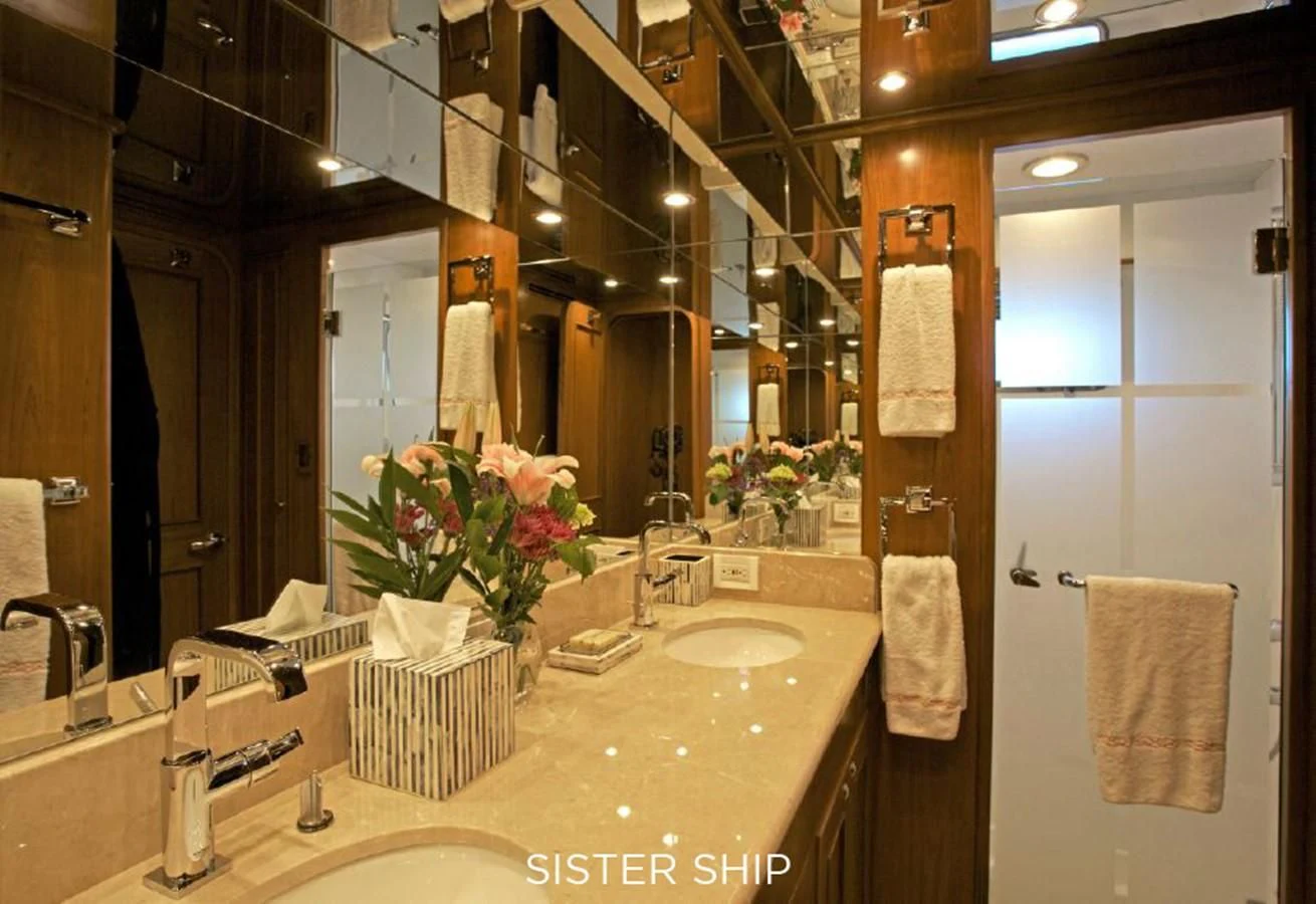 a bathroom with a sink and a mirror aboard 860 MY Yacht for Sale