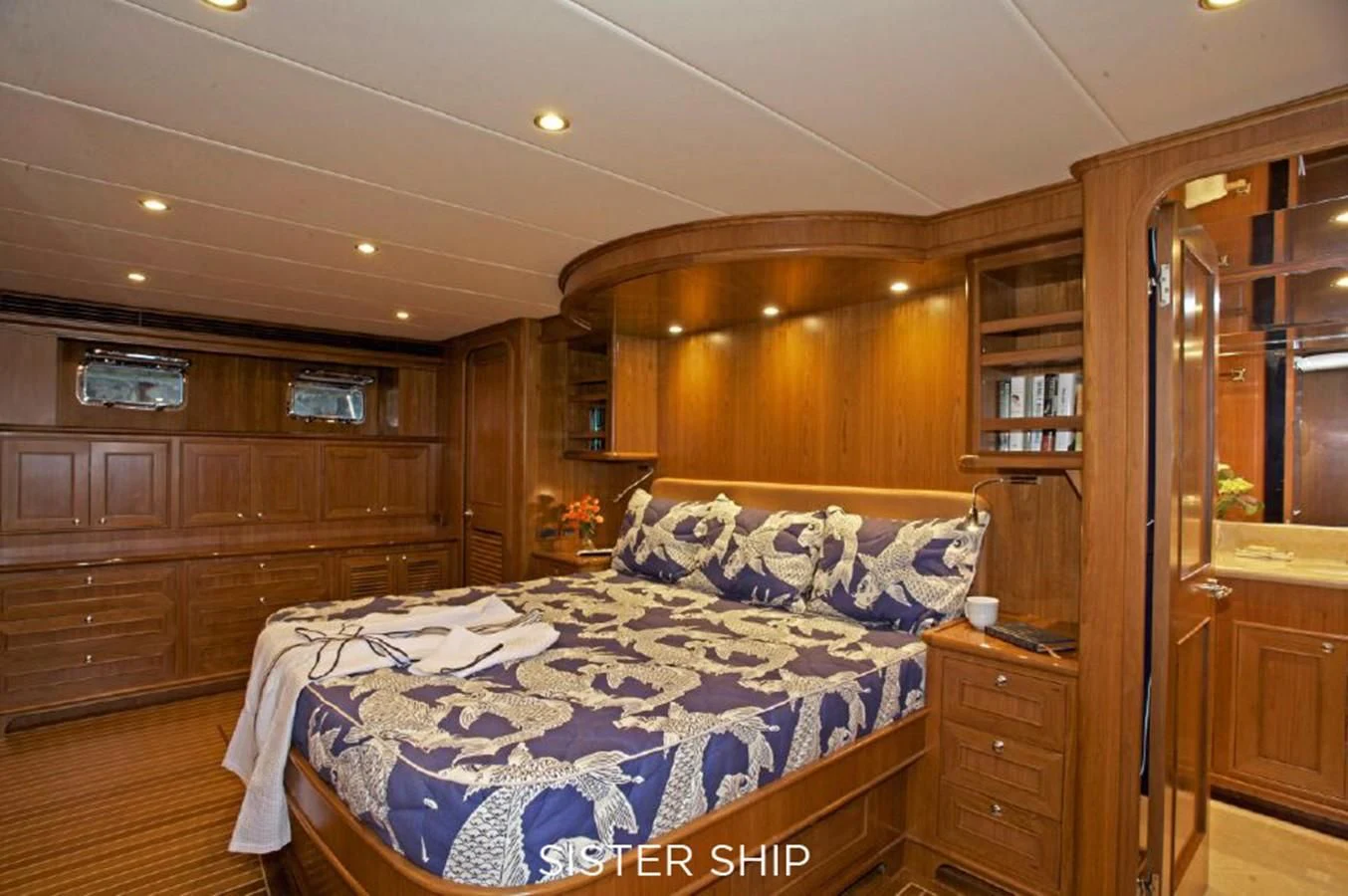 a bedroom with wood walls aboard 860 MY Yacht for Sale