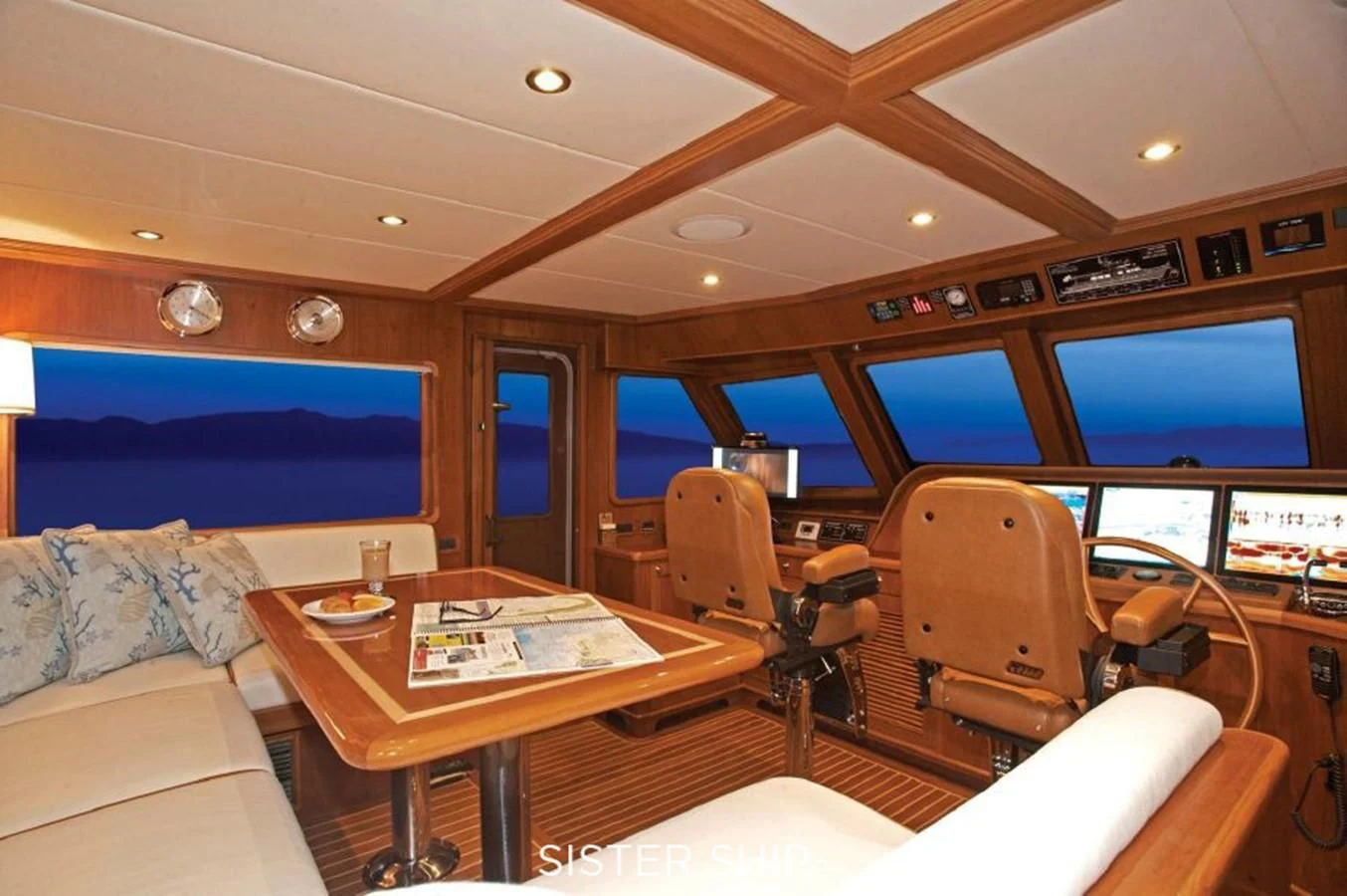 a room with a table and chairs aboard 860 MY Yacht for Sale