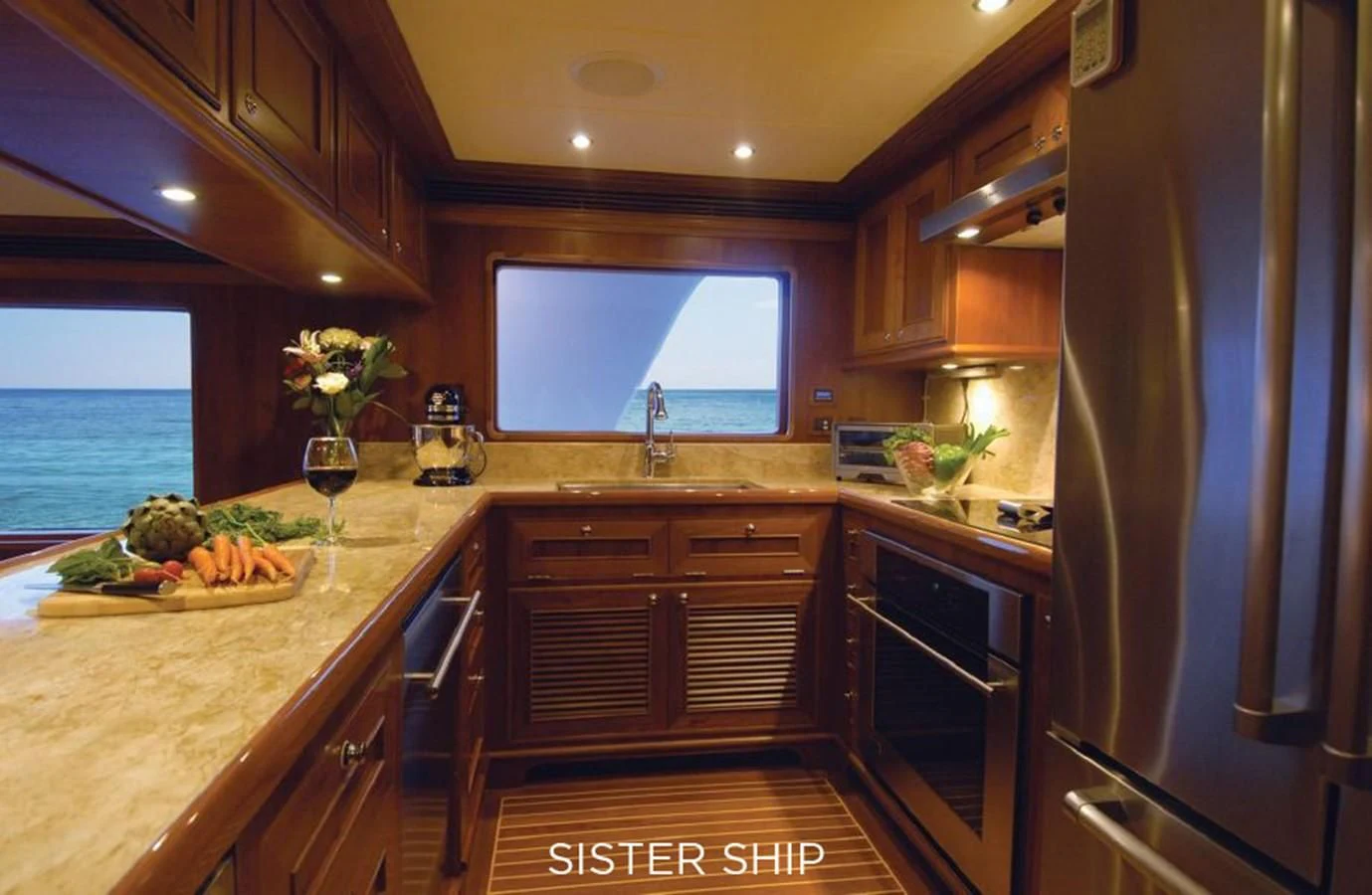a kitchen with wooden cabinets aboard 860 MY Yacht for Sale