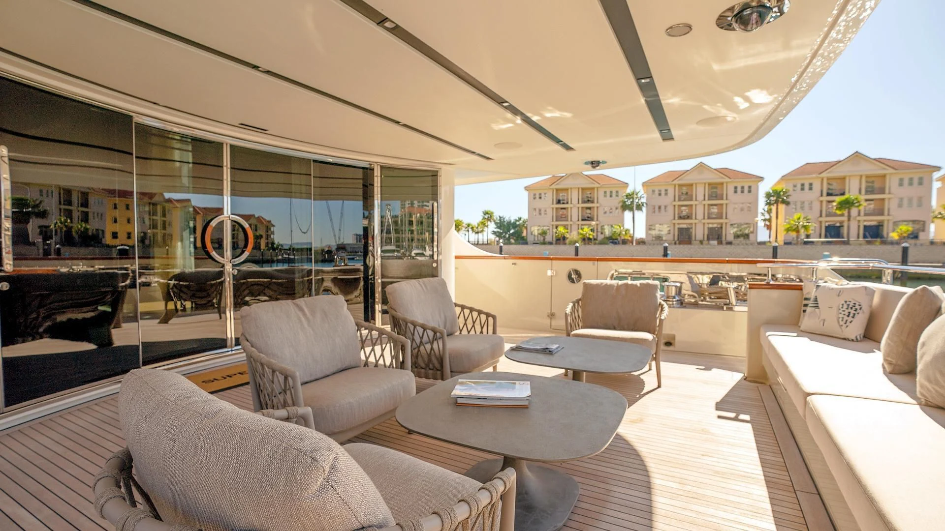 a living room with a large window aboard SUPERNOVA Yacht for Sale