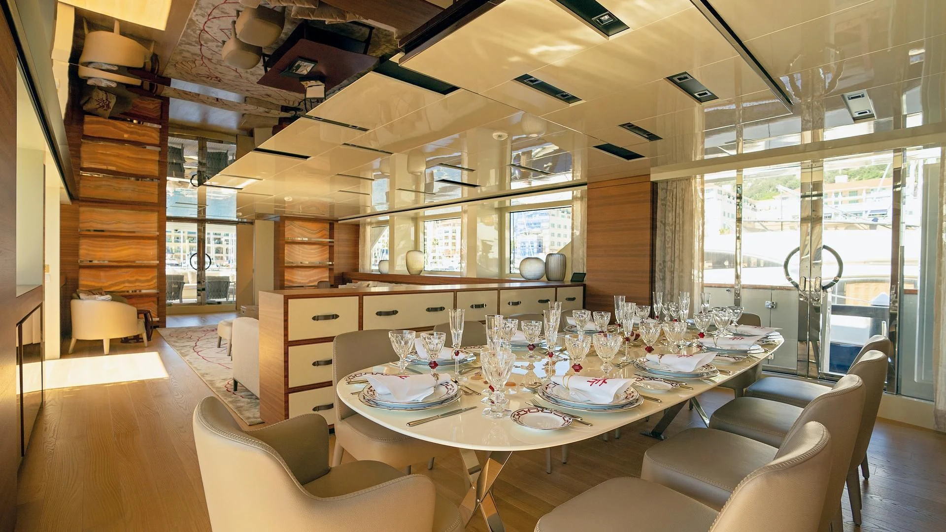 a large dining room with a large table and chairs aboard SUPERNOVA Yacht for Sale