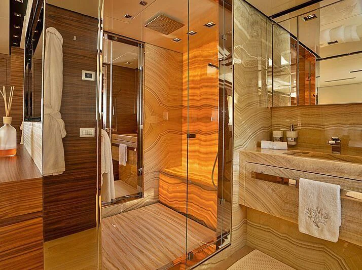 a bathroom with a glass shower aboard SUPERNOVA Yacht for Sale