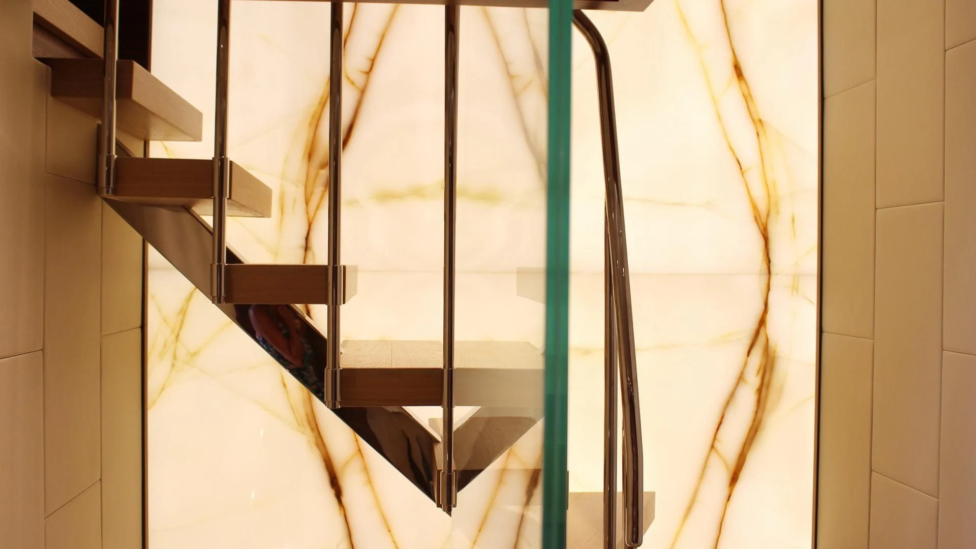 a staircase with glass railings aboard SUPERNOVA Yacht for Sale