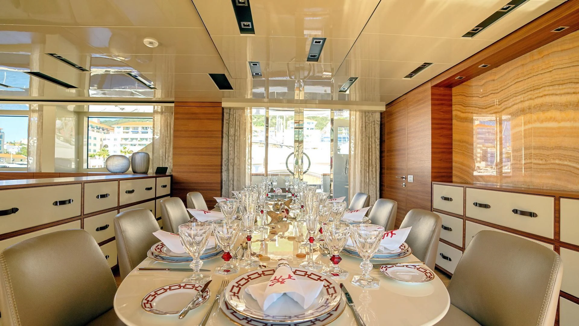 a dining room with a table set aboard SUPERNOVA Yacht for Sale