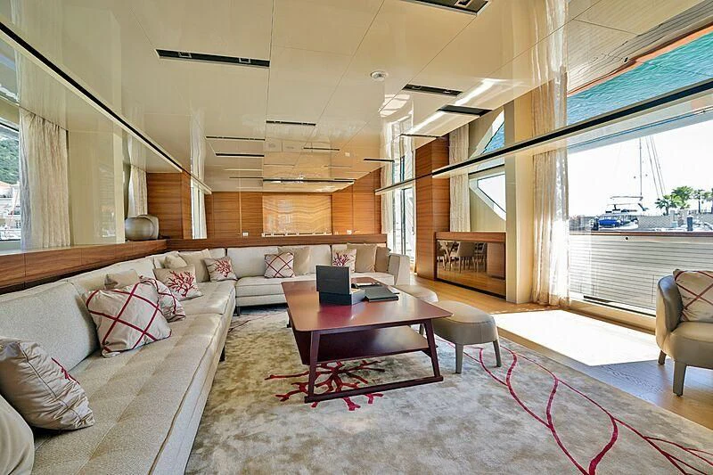 a living room with a couch and a table aboard SUPERNOVA Yacht for Sale