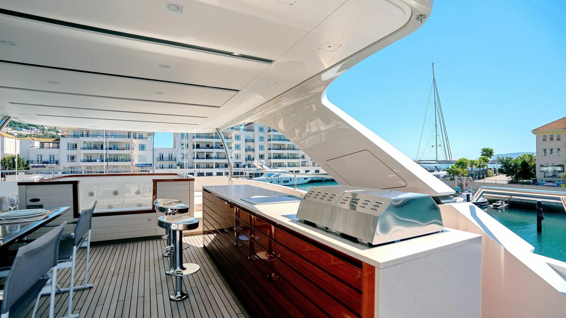 a deck with a large white boat aboard SUPERNOVA Yacht for Sale