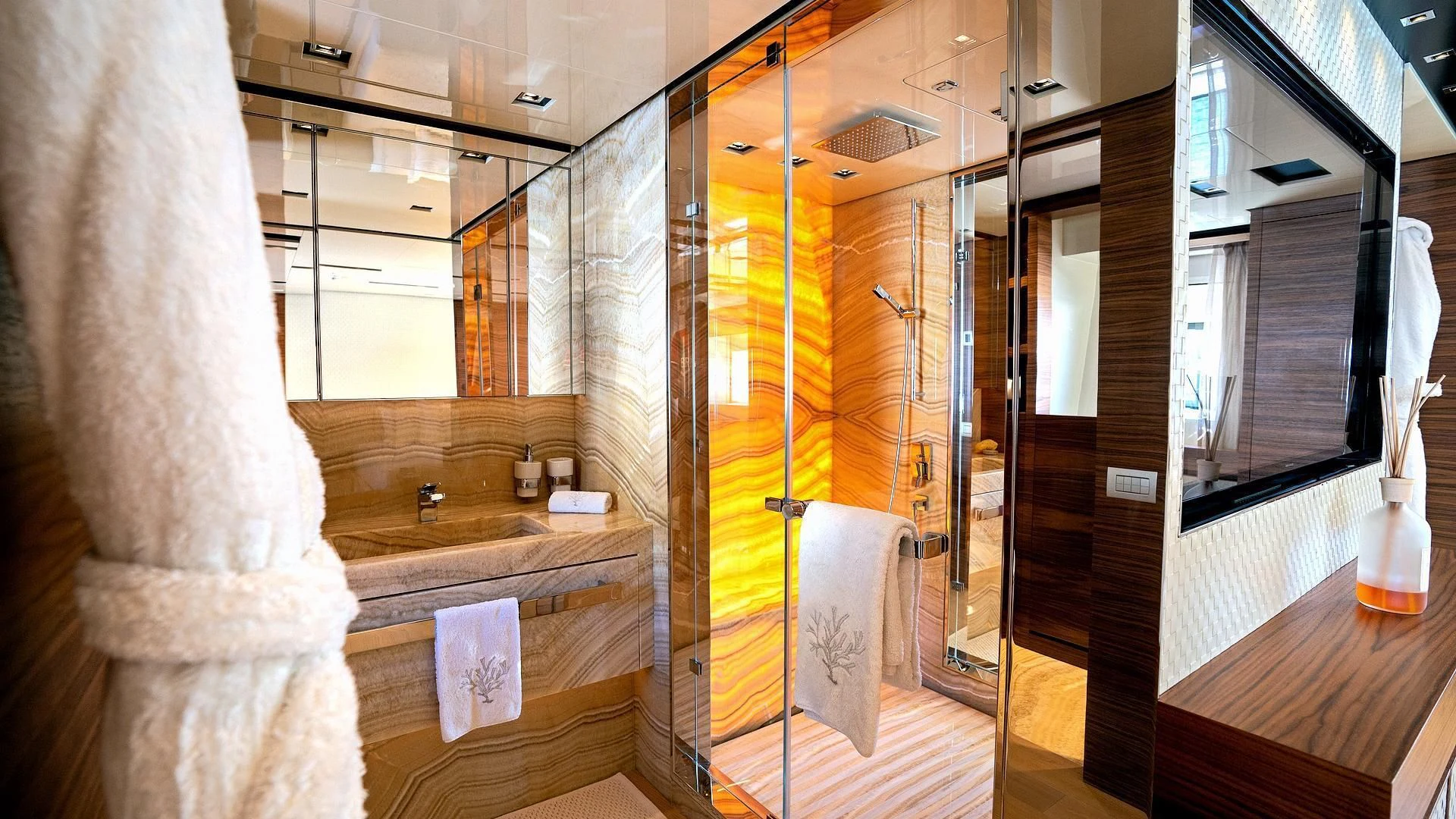 a bathroom with a large mirror aboard SUPERNOVA Yacht for Sale