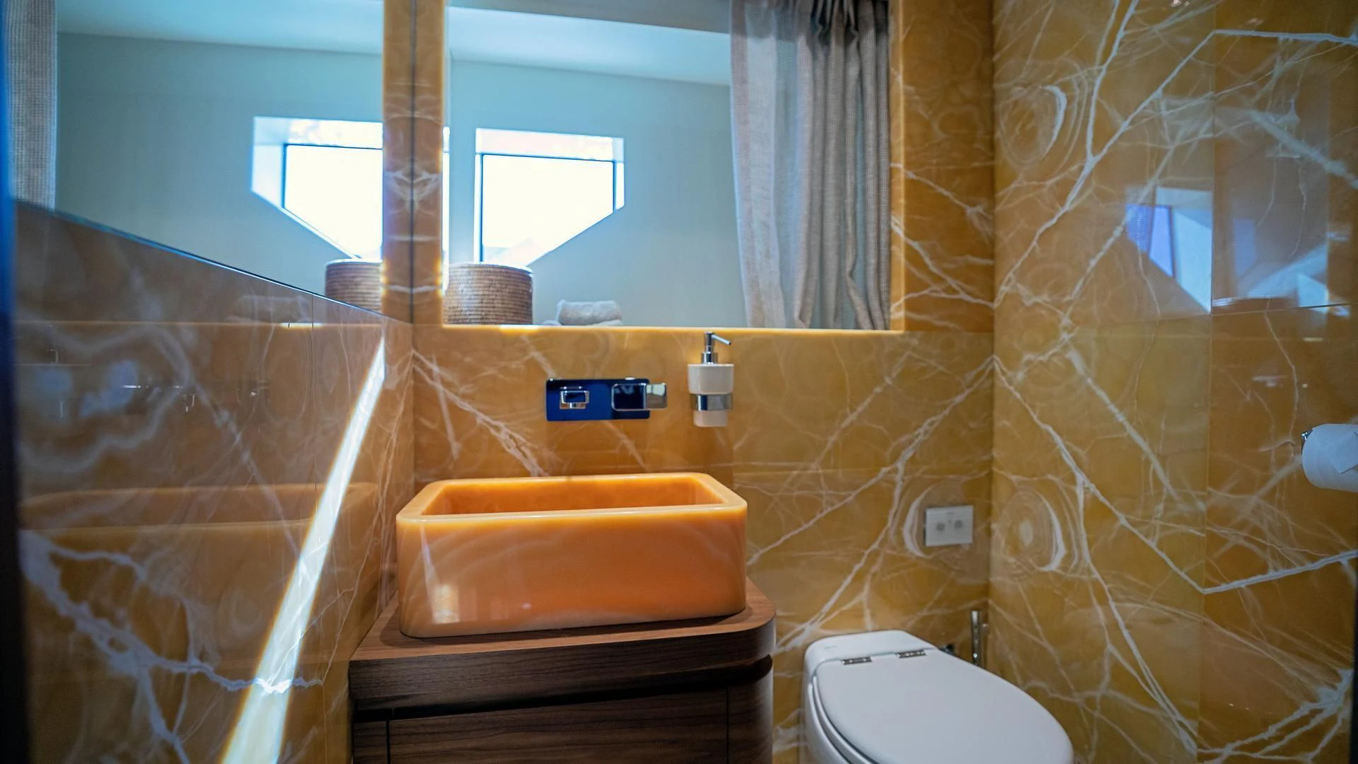 a bathroom with a tub sink and toilet aboard SUPERNOVA Yacht for Sale