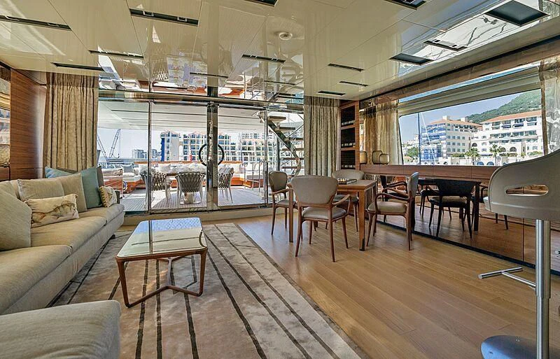a living room with a wood floor aboard SUPERNOVA Yacht for Sale