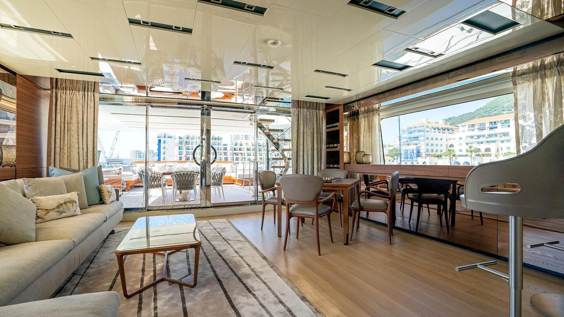 a living room with a wood floor aboard SUPERNOVA Yacht for Sale