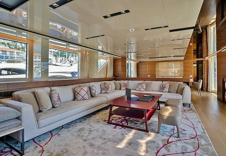 a living room with a couch and a table aboard SUPERNOVA Yacht for Sale