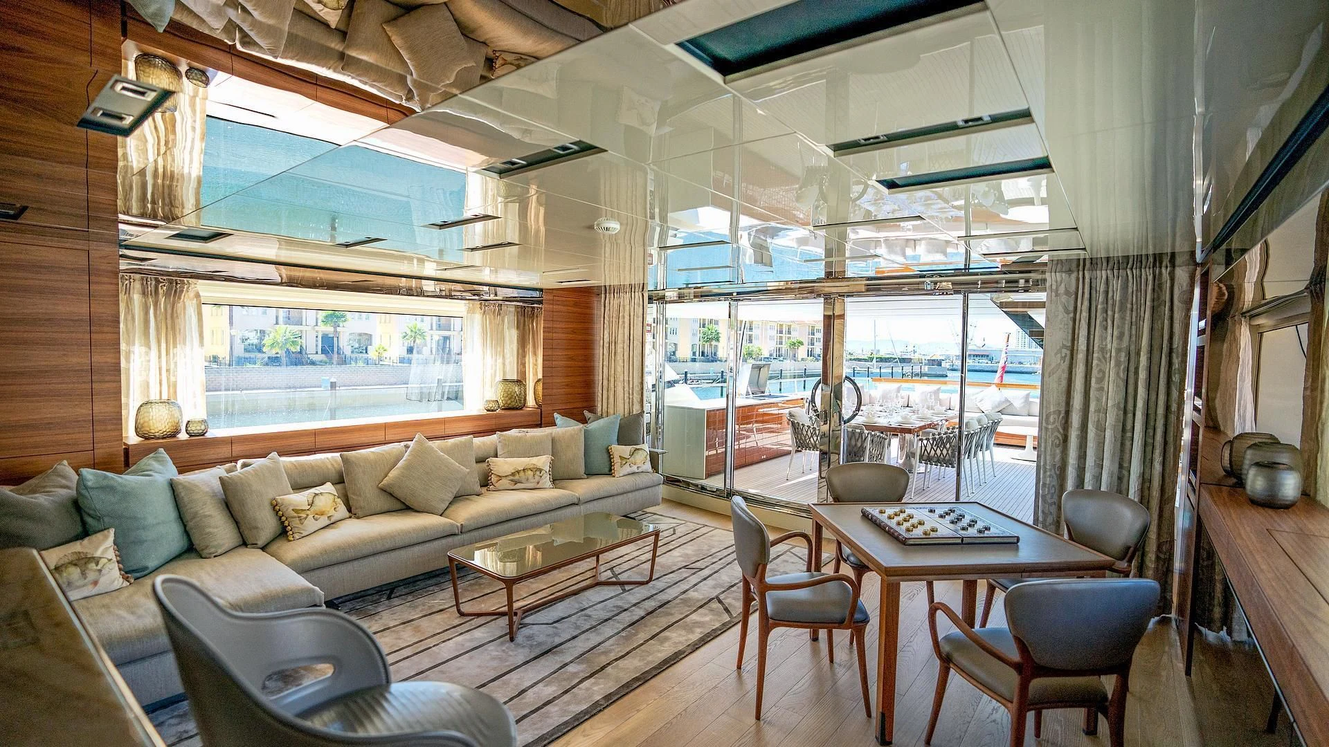 a living room with a couch and a table aboard SUPERNOVA Yacht for Sale
