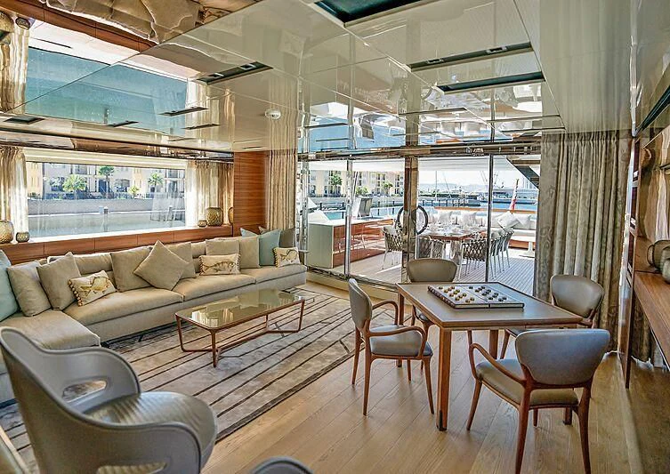 a living room with a large window aboard SUPERNOVA Yacht for Sale