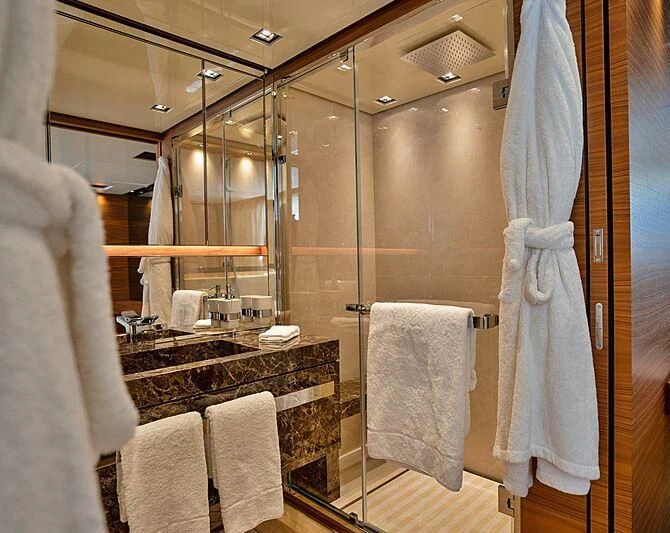 a bathroom with a glass shower aboard SUPERNOVA Yacht for Sale