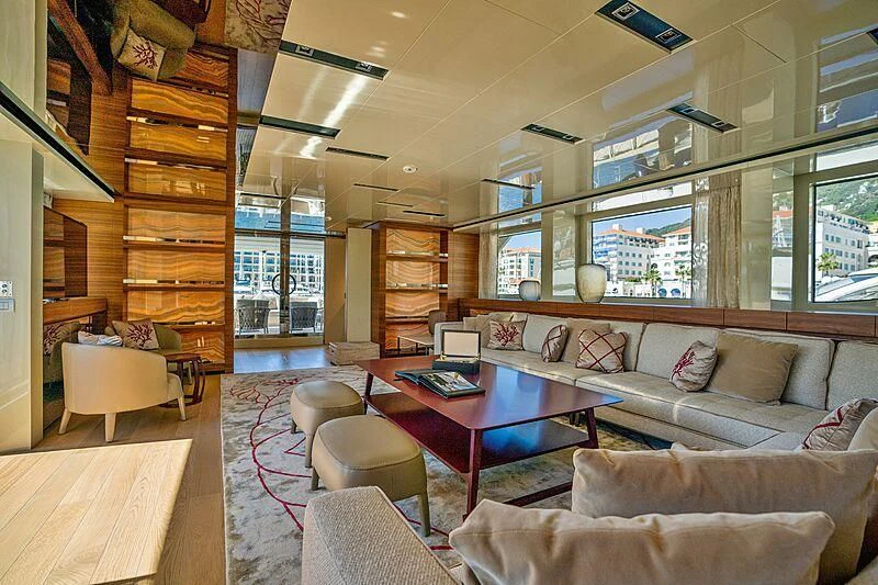 a living room with a bookcase aboard SUPERNOVA Yacht for Sale