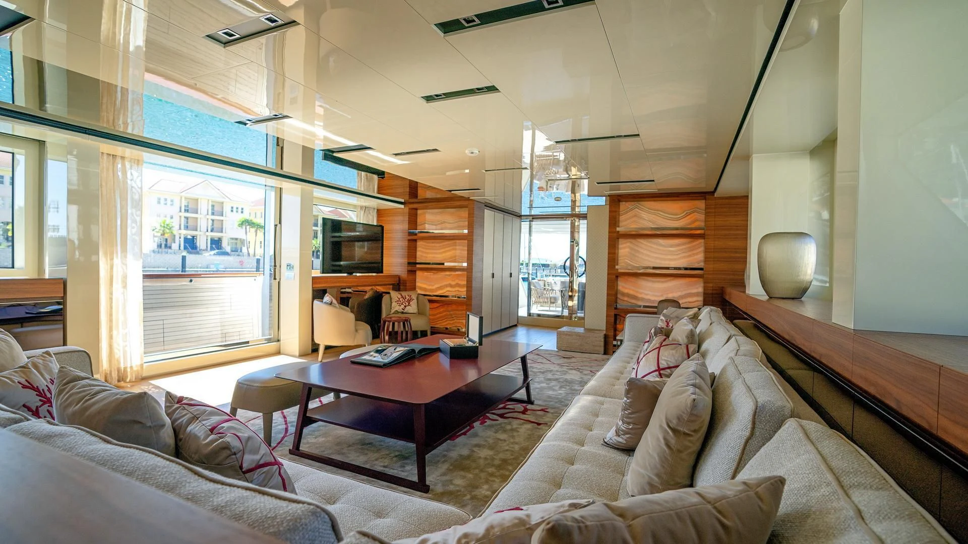 a living room with a couch and a tv aboard SUPERNOVA Yacht for Sale