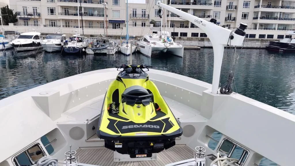 a yellow and white boat on the water aboard SUPERNOVA Yacht for Sale