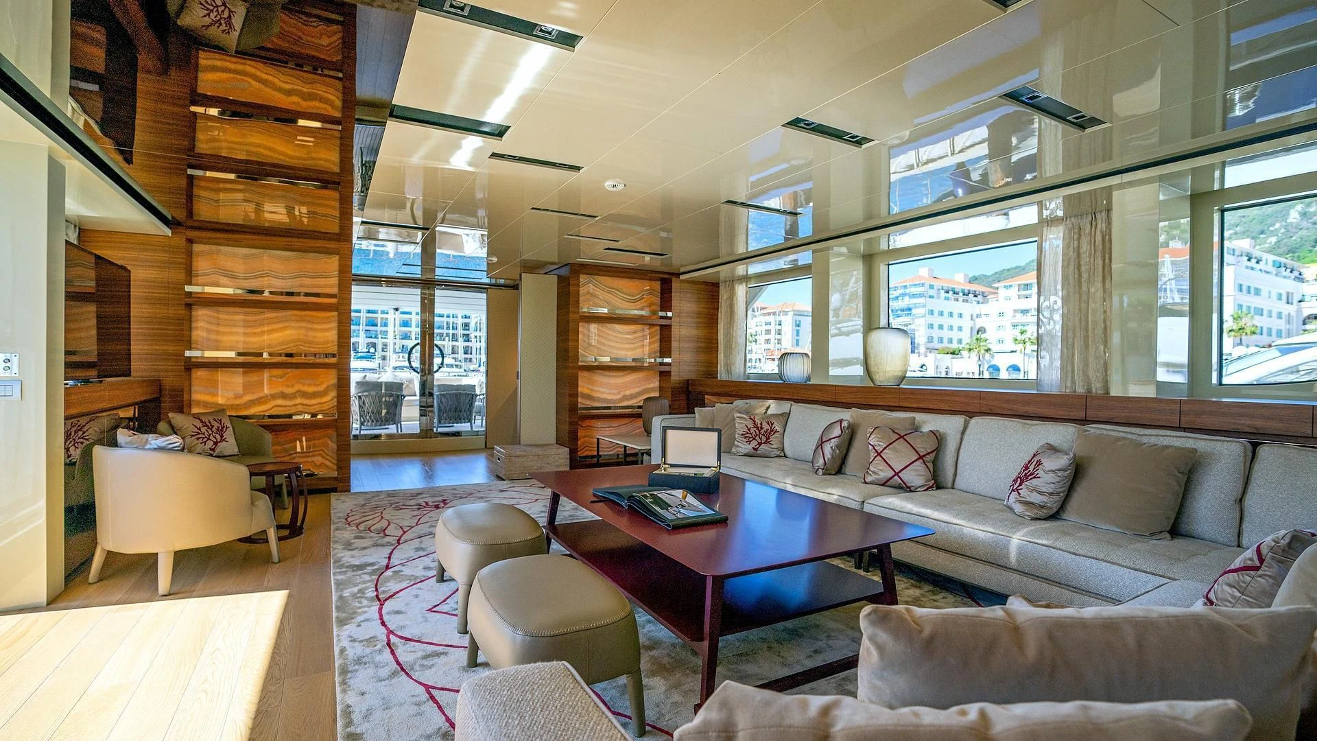 a living room with a wood staircase aboard SUPERNOVA Yacht for Sale