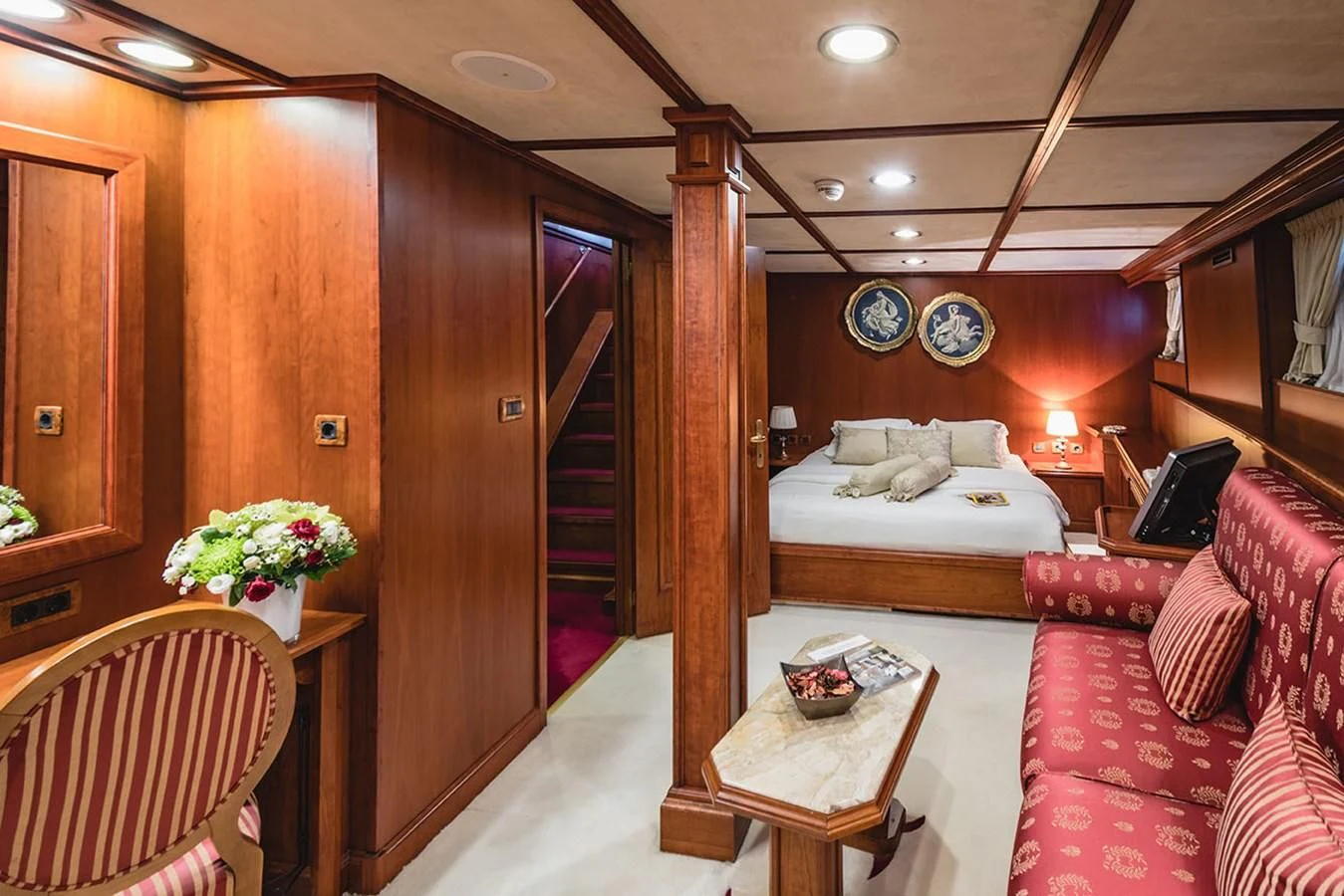 a room with a bed and a table aboard SEAGULL II Yacht for Sale