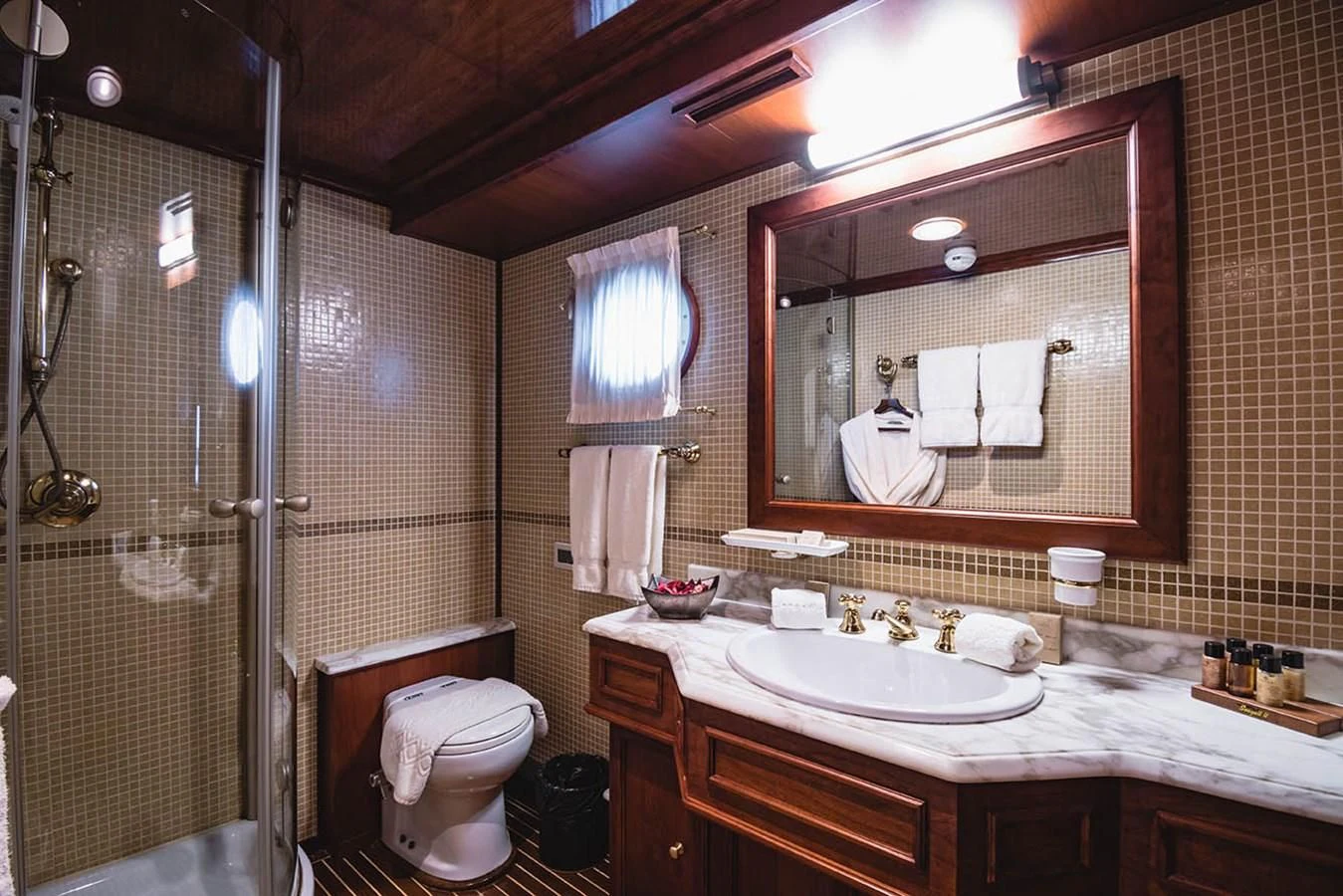 a bathroom with a large mirror aboard SEAGULL II Yacht for Sale