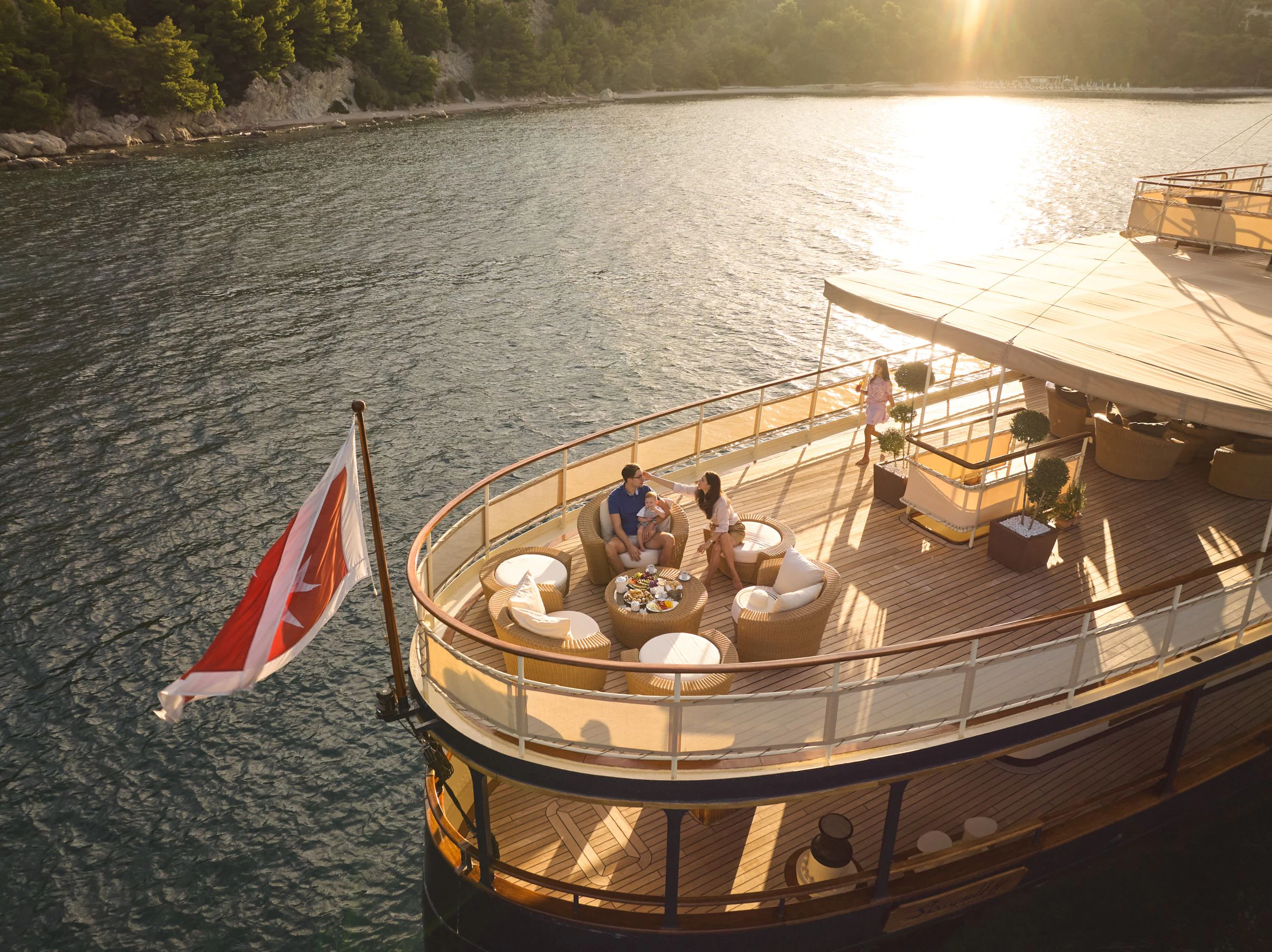 a boat with a flag on it aboard SEAGULL II Yacht for Sale