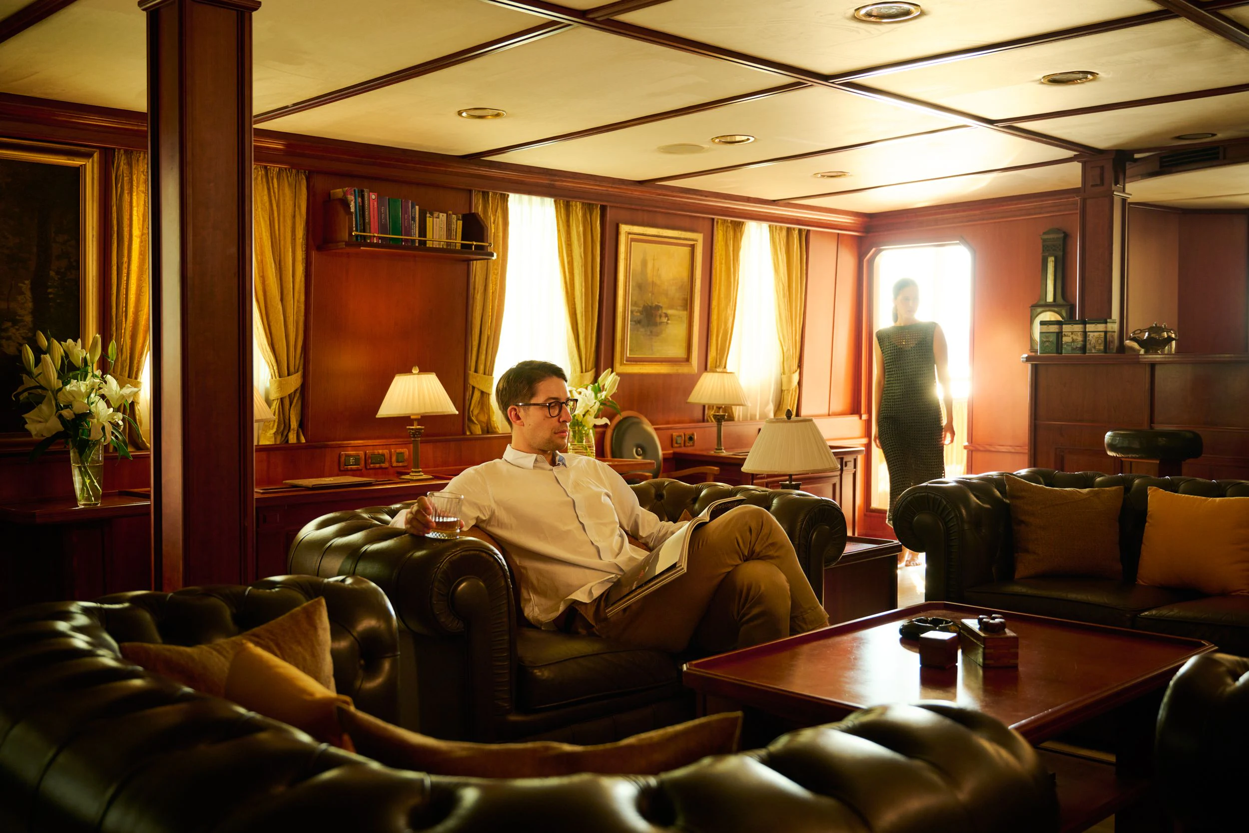 a person sitting in a living room aboard SEAGULL II Yacht for Sale
