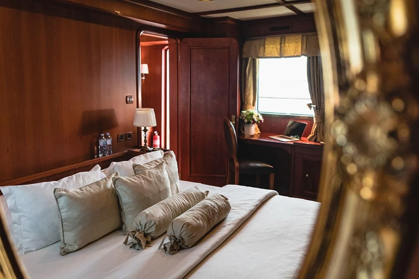 a bed with white sheets and pillows aboard SEAGULL II Yacht for Sale