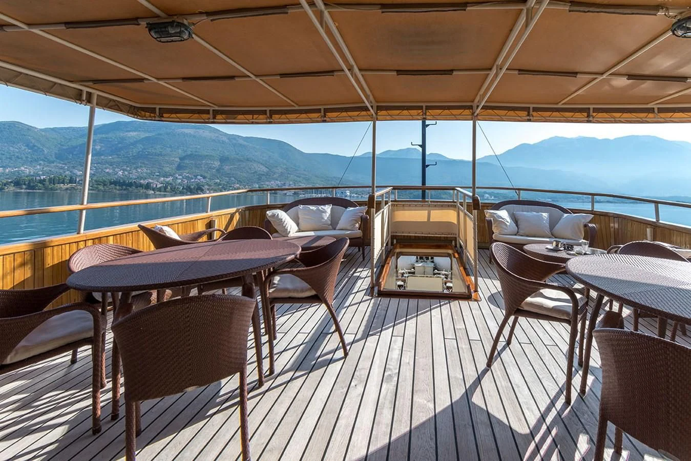 a deck with chairs and tables on it aboard SEAGULL II Yacht for Sale