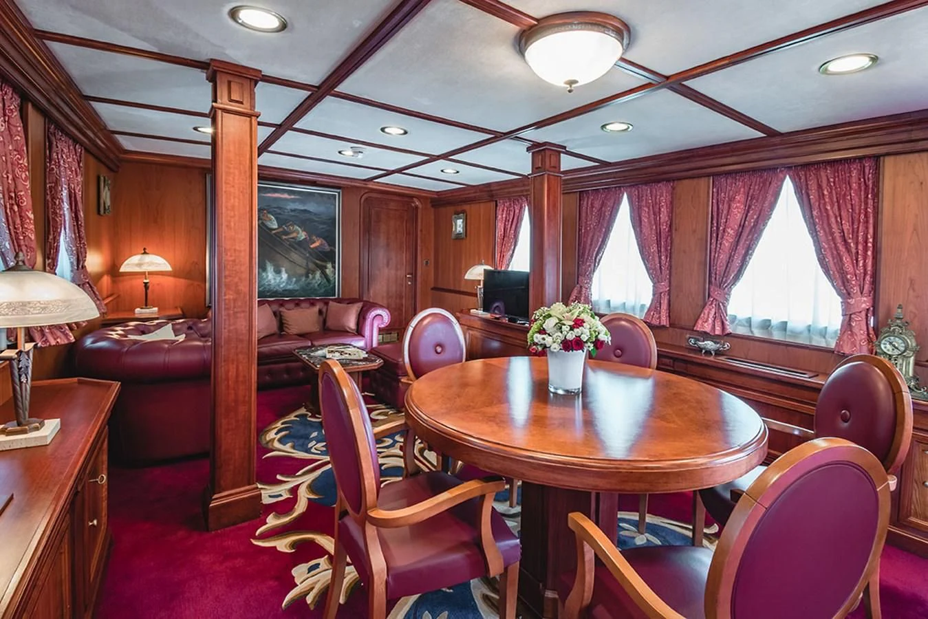 a dining table in a living room aboard SEAGULL II Yacht for Sale