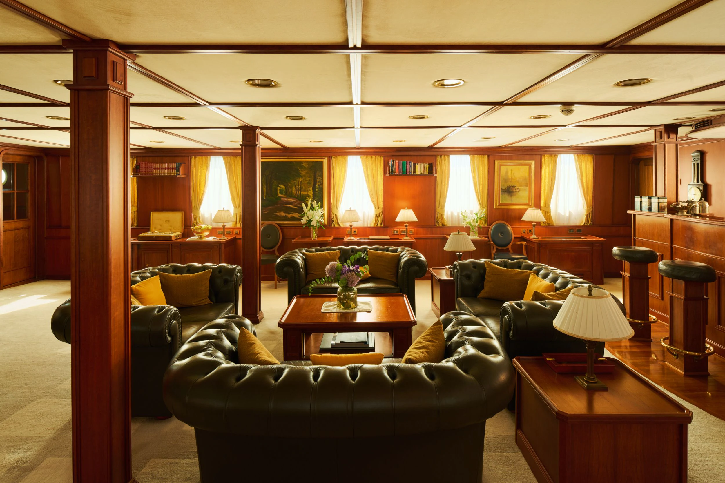 a living room with leather couches aboard SEAGULL II Yacht for Sale