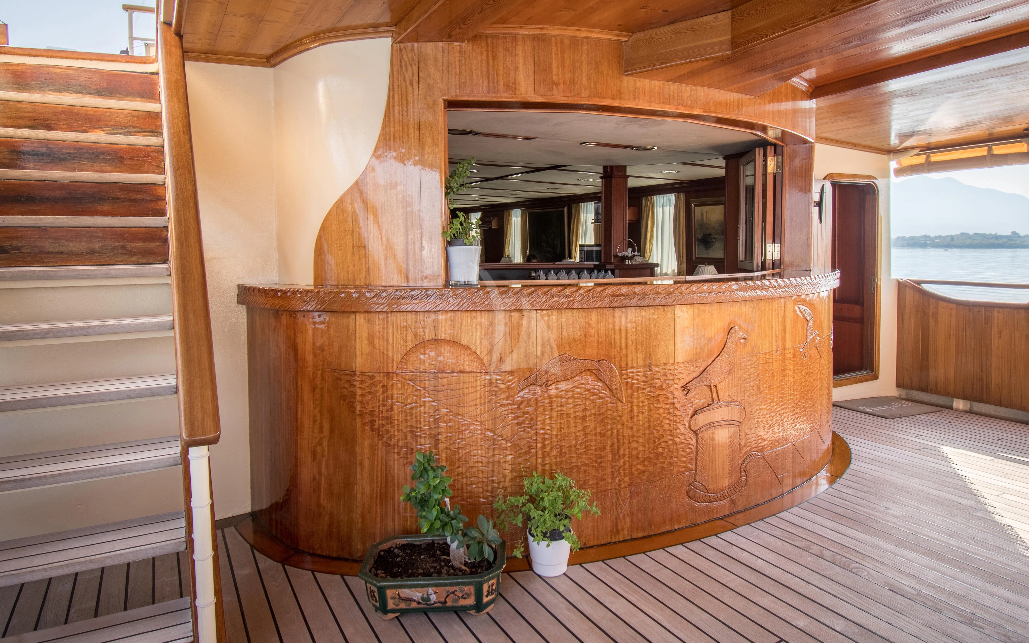 a fireplace with a plant in it aboard SEAGULL II Yacht for Sale