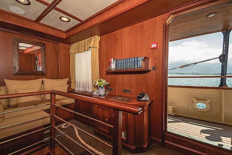a room with a bed and a desk aboard SEAGULL II Yacht for Sale