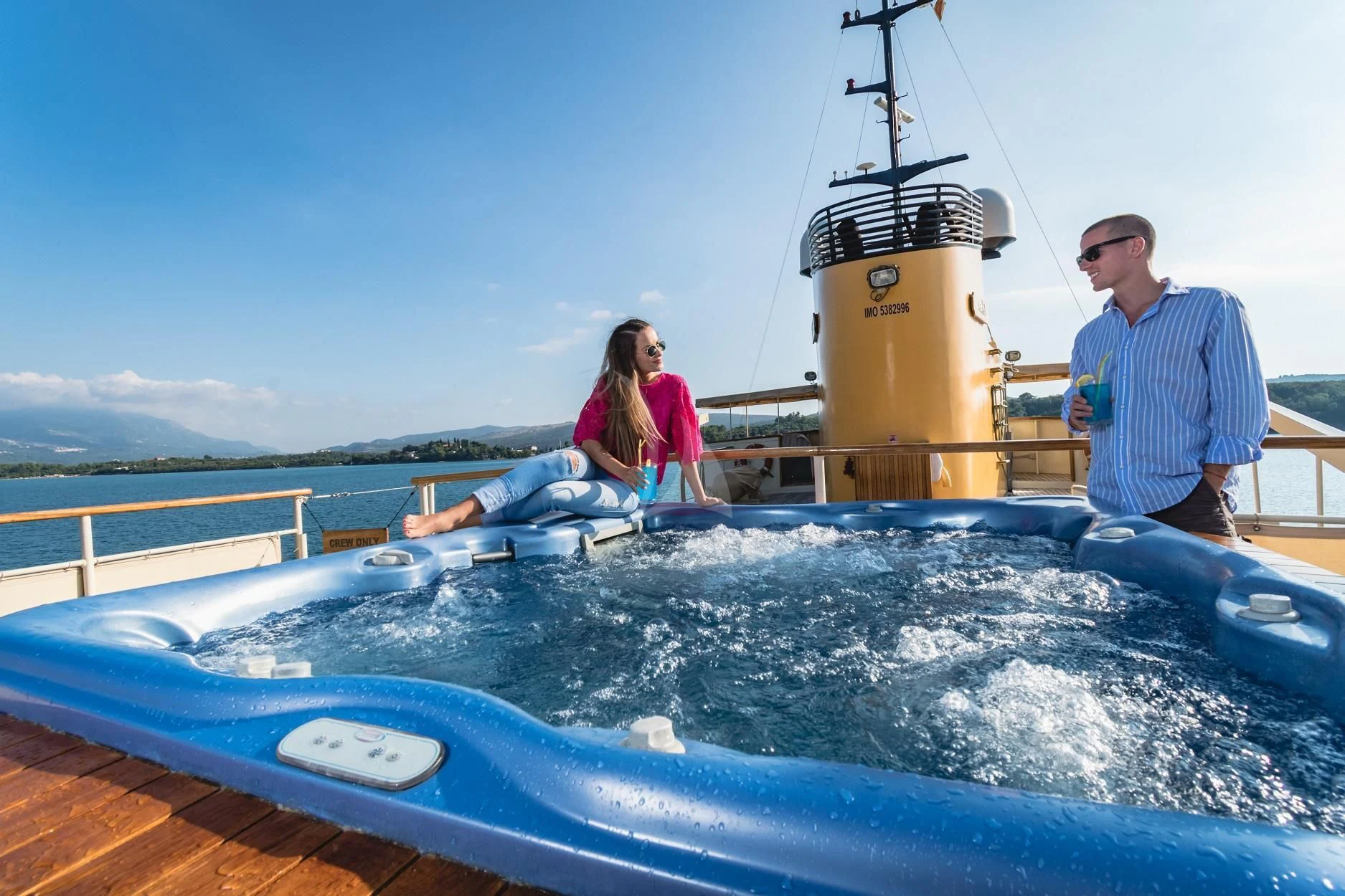 a man and woman sitting on a boat in the water aboard SEAGULL II Yacht for Sale